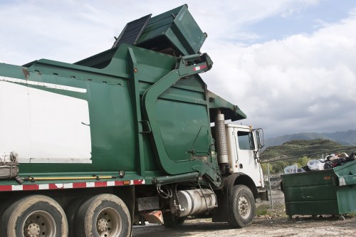 Wembley business waste collection vehicle by a commercial property exterior